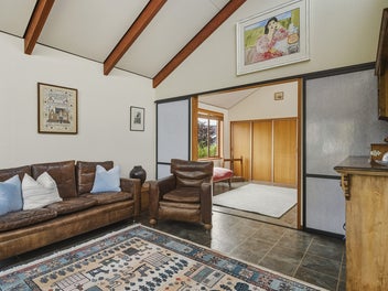 Light-filled mid-century with workshop and garage