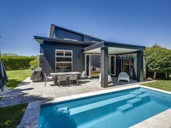 Executive living, private oasis with a pool