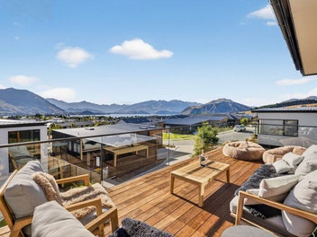 Large family living with panoramic lake views