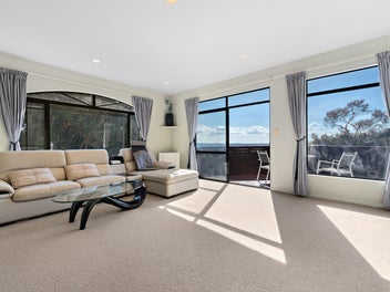 Sea-View Living with Balcony Access from Bedroom