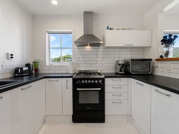 A Clever Layout with Decks, Views & All-Day Sun!