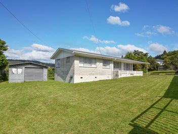 Brick, Fenced & Full of Potential