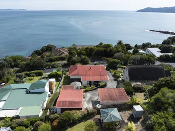 STUNNING VIEWS + INCOME! WALK TO BEACH