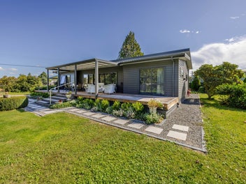 Modern home, beautiful gardens, village living