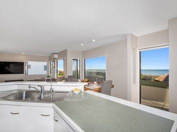 Sweeping views, beachfront living