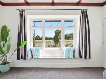 Home with Sunroom and Practical Living Spaces