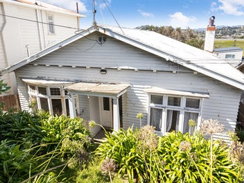 1930s Home & Income with Exceptional Potential