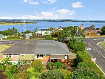 Prime Corner-site with Water Views & Potential