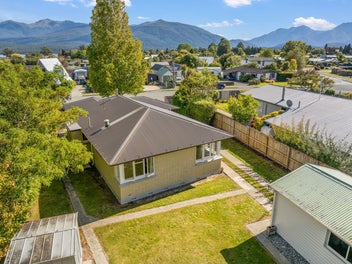 Framed by Trees, Backed by Mountains