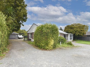 Three bedroom home with garage and two extra outbu