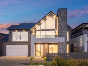 Elevated Coastal Luxury with Park and Sea Views