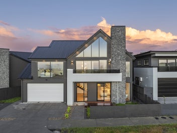 Elevated Coastal Luxury with Park and Sea Views