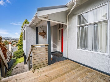 Elevated Home with Sunroom & Charm