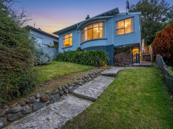 Elevated Home with Sunroom & Charm
