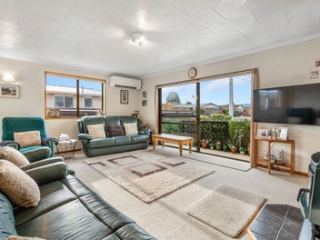 Sun-soaked family living with exceptional garaging
