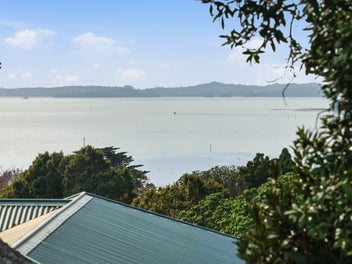 Elevated Coastal Living with Do-Up Opportunity