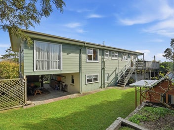 Elevated Coastal Living with Do-Up Opportunity