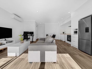 Near-New Top-Floor Living with River Views