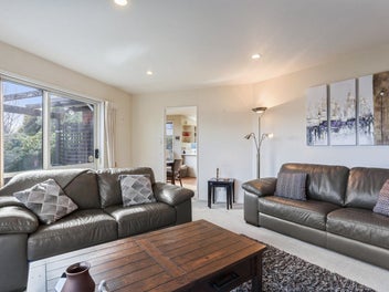 Sunny And Spacious With Double Garaging!