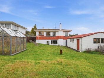 Solid, sunny family home with 4 car garaging