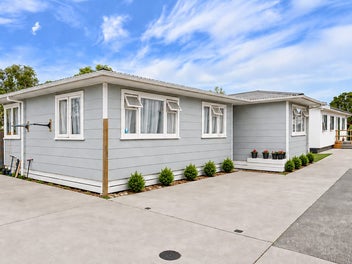 TWO HOMES - TWO INCOMES ONE TITLE.