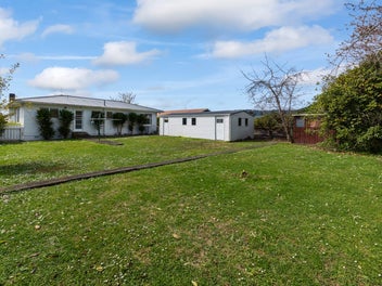 Big Yard, Big Garage, Great First Home!