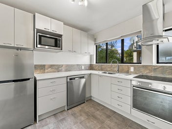 Private Corner Unit with a Courtyard & Garage