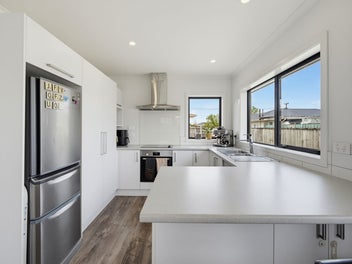 Sunlit Family Living with Deckside Appeal