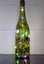 Decorated wine bottle with coloured lights Carousel 1