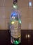 Decorated wine bottle with coloured lights Carousel 2