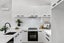 U-Shaped Kitchen in Black & White Style, with Stone Waterfall Carousel 4