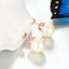 Studs Earrings White Round Pearls Rose Gold Plated Studs Carousel 2