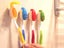 8Pcs Smile Face Toothbrush Cover Holder with Suction Cup Random Color Carousel 4