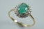 Elegant natural emerald & diamond halo ring in 9ct Carousel 4
