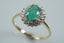 Elegant natural emerald & diamond halo ring in 9ct Carousel 6
