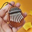 8 Key Mini Ex quisite Finger Thumb Piano Marimba Musical Good Accessory Pendan Carousel 3