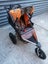 Orange Bob Revolution jogging stroller with accessories Carousel 7