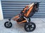Orange Bob Revolution jogging stroller with accessories Carousel 5
