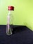 Glass bottle, shaped like a hip flask, 100 ml Carousel 2