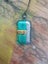 Green & silver metallic foil art glass pendant on new waxed cord. Carousel 2