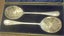 PAIR OF ANTIQUE DECORATIVE SILVER SERVING SPOONS Carousel 3