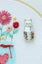 Flamingo Toes Needle Minder - White Floral Cat Carousel 3