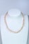 pearl necklace peach pink overtones Carousel 1