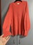 Orange knit style sweater Carousel 1
