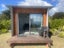 Tidy Cabin with heatpump, deck, lighting and power Carousel 1