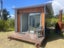 Tidy Cabin with heatpump, deck, lighting and power Carousel 3