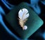 Elegant Feather Brooch with Pearl Accent Carousel 8