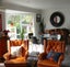 Two Orange Retro 1960s Chairs Carousel 1