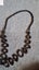 BLACK LONG BEADED NECKLACE WITH CIRCLE LIKE PENDENTS Carousel 1