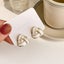 White Enamel Knot Stud Earrings Carousel 1